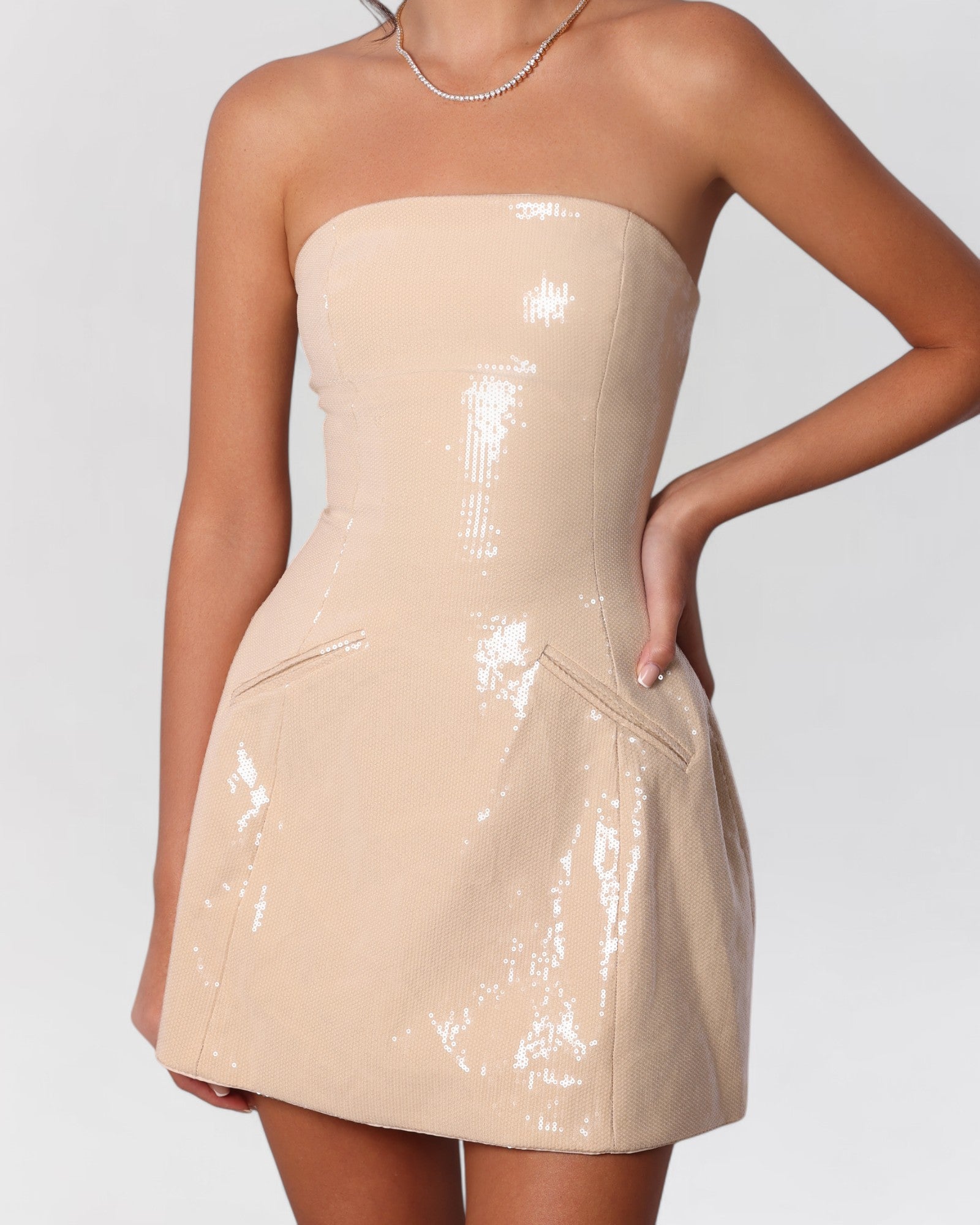 Nude sequin strapless a-line pocket mini dress